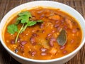 A bowl of bean soup. First course. Dinner. Tomato soup with beans, carrots, parsley and bay leaf Royalty Free Stock Photo