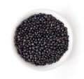 Bowl of Beluga lentil isolated on white, from above