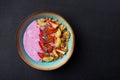 Bowl with berry smoothie, granola, chia seeds, banana, nuts, strawberries Royalty Free Stock Photo