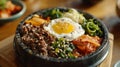 A bowl of bimbimbap with egg and vegetables Royalty Free Stock Photo