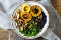 Black rice with roasted delicata squash, massaged kale and shiitake mushrooms