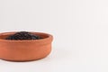 Bowl of black wild rice isolated on white Royalty Free Stock Photo