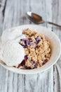Bowl of Blackberry Blueberry Cobbler with Vanilla Ice Cream Scoops