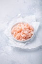 Bowl with boiled small peeled shrimps on kitchen table Royalty Free Stock Photo