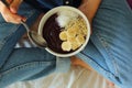 Bowl breakfast in the bed. Breakfast girl a bowl. Royalty Free Stock Photo