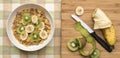 Bowl of Breakfast Cereal with Banana and Kiwi Fruit Royalty Free Stock Photo