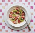 Bowl of Breakfast Cereal with Fresh Fruit. Royalty Free Stock Photo