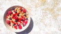 Bowl of breakfast rings with milk and berries isolated on white background, top view.Delicious corn rings with berries Royalty Free Stock Photo