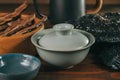 Bowl with brewed Chinese Lingzhi or Reishi mushroom on wooden table. Asian herbs for health. Herbal medicine Royalty Free Stock Photo