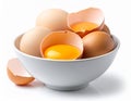 Bowl of Brown and White Eggs with Broken Eggshells on White Background Royalty Free Stock Photo