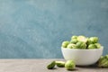 Bowl with brussels sprout on table, space for text Royalty Free Stock Photo