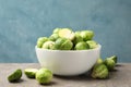 Bowl with brussels sprout on grey table Royalty Free Stock Photo