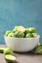 Bowl with brussels sprout on grey table Royalty Free Stock Photo