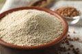 Bowl of buckwheat flour on cloth, closeup Royalty Free Stock Photo