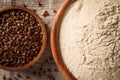 Bowl of buckwheat flour on cloth, top view Royalty Free Stock Photo