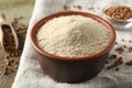 Bowl of buckwheat flour and cloth on wooden table Royalty Free Stock Photo