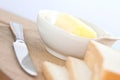 Bowl of butter with slices of bread Royalty Free Stock Photo