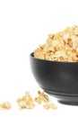 Bowl of buttery popcorn isolated