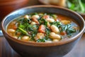 A bowl of caldo gallego with greens and white beans Royalty Free Stock Photo