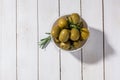 Bowl with canned olives on white background