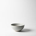 The bowl casts a soft shadow to its right, indicating a light source from Royalty Free Stock Photo