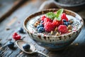 a bowl of cereal, granola, berries and chia seeds