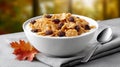 Bowl of cereal with raisins in a cozy kitchen setting during autumn Royalty Free Stock Photo