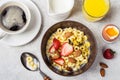 Bowl with cereal rings cheerios, strawberries and milk. Fresh coffee, orange juice and egg. Balanced breakfast concept Royalty Free Stock Photo