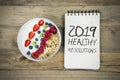 Bowl of cereal with text of 2019 healthy resolutions Royalty Free Stock Photo