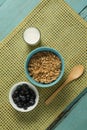 Bowl of cereals and blueberries with glass of yogurt for breakfast Royalty Free Stock Photo