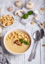 Bowl of champignon mushroom cream soup puree with croutons and basil leaf Royalty Free Stock Photo