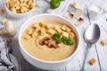 Bowl of champignon mushroom cream soup puree with croutons and basil leaf Royalty Free Stock Photo