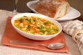 Bowl of chicken noodle soup with rustic bread Royalty Free Stock Photo