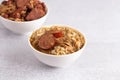 Bowl of Chicken and Sausage Gumbo with Red Beans and Rice with Sausage on the Side Royalty Free Stock Photo