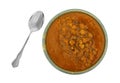 Bowl of chickpea soup with a spoon on a white background Royalty Free Stock Photo