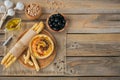 A bowl of chickpeas homemade hummus with olive oil, black olives and crispbread