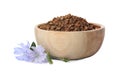 Bowl of chicory granules and flowers on white background