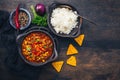 Bowl of chili con carne with rice and toppings Royalty Free Stock Photo