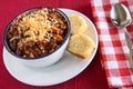 Bowl of Chili With Corn Bread Muffin Close Up