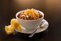 Bowl of chili with corn muffin