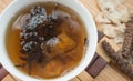 Bowl of Chinese herbal tea with raw herbal Royalty Free Stock Photo