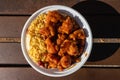 Bowl of Chinese Style General Tso`s Chicken with a Side of Fried Rice Royalty Free Stock Photo