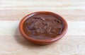 Bowl of chocolate almond hazelnut butter on a table