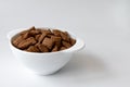 Bowl with chocolate corn pads isolated on white background, cereals breakfast Royalty Free Stock Photo