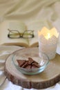 Chocolate, Candle, Book and Glasses Royalty Free Stock Photo