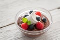 Berry bowl with dollop of cream. Royalty Free Stock Photo