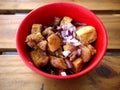 Bowl of chopped tofu and pork in soy sauce