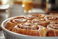 A bowl of cinnamon rolls with glaze on top Royalty Free Stock Photo