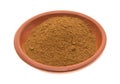 Bowl of cinnamon spice on a white background