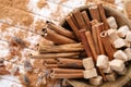Bowl with cinnamon sticks and sugar on wooden background, closeup Royalty Free Stock Photo